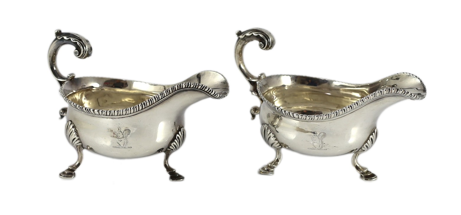 A near pair of George III silver sauceboats